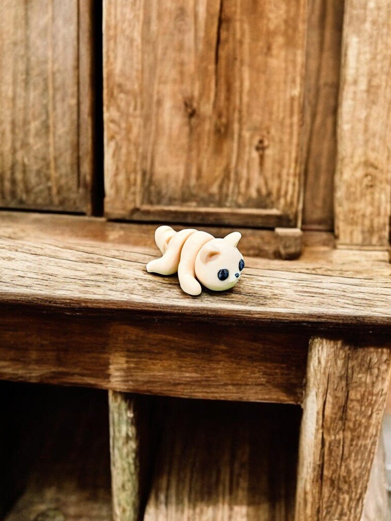 Tiny Baby Cat Mini, an articulated 3D-printed collectible figure from SpaceCity3D (Minis)